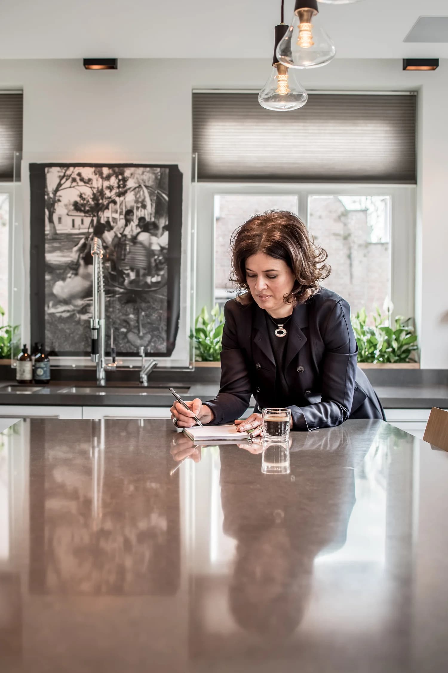 Valery Chong sketching at the kitchen island in Villa Wassenaar