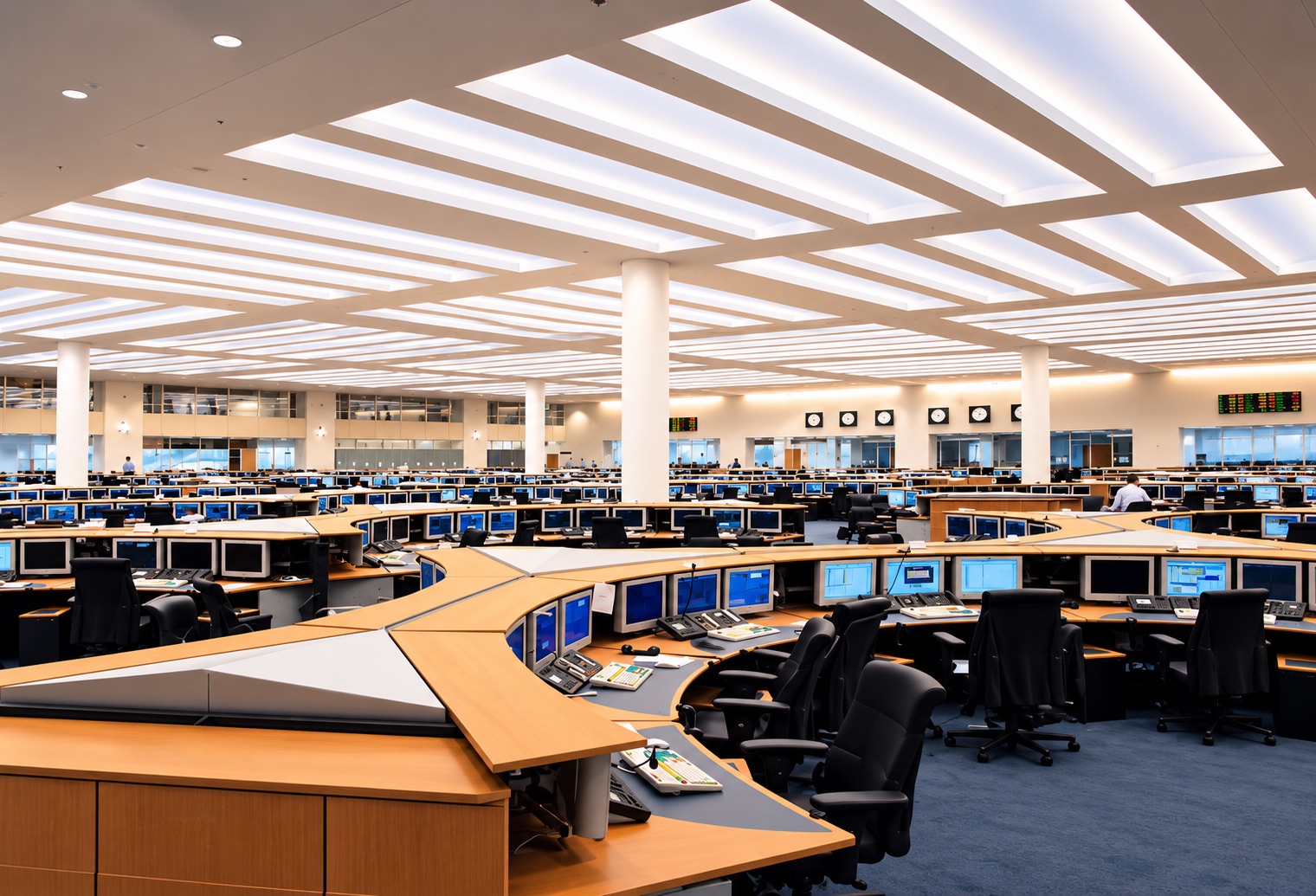 ABN AMRO dealing room with rows of trading desks beneath a geometric illuminated ceiling.